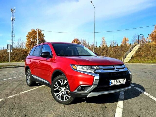 Красный Мицубиси Аутлендер, объемом двигателя 2.4 л и пробегом 174 тыс. км за 14300 $, фото 1 на Automoto.ua