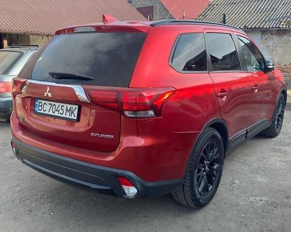 Красный Мицубиси Аутлендер, объемом двигателя 2.36 л и пробегом 60 тыс. км за 15500 $, фото 1 на Automoto.ua