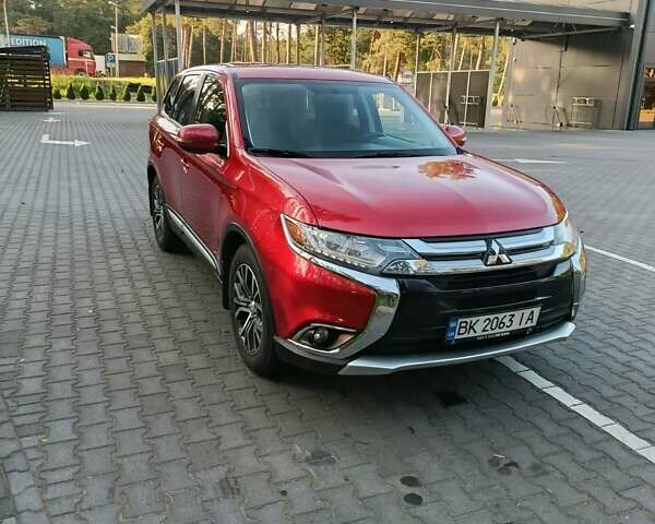 Червоний Міцубісі Аутлендер, об'ємом двигуна 2.4 л та пробігом 133 тис. км за 14700 $, фото 1 на Automoto.ua