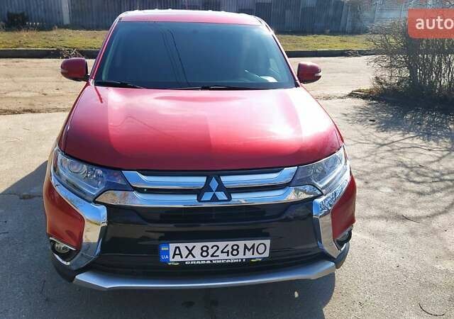 Красный Мицубиси Аутлендер, объемом двигателя 2.36 л и пробегом 100 тыс. км за 16500 $, фото 1 на Automoto.ua