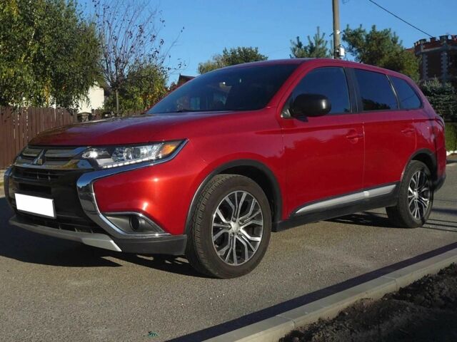 Красный Мицубиси Аутлендер, объемом двигателя 2.4 л и пробегом 117 тыс. км за 10500 $, фото 1 на Automoto.ua