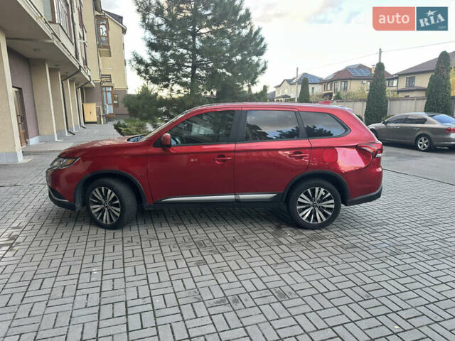 Червоний Міцубісі Аутлендер, об'ємом двигуна 2.36 л та пробігом 95 тис. км за 12500 $, фото 1 на Automoto.ua