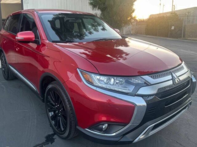 Красный Мицубиси Аутлендер, объемом двигателя 2.4 л и пробегом 58 тыс. км за 4600 $, фото 1 на Automoto.ua