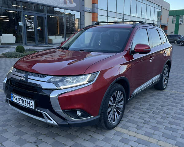 Красный Мицубиси Аутлендер, объемом двигателя 2.36 л и пробегом 100 тыс. км за 16500 $, фото 1 на Automoto.ua