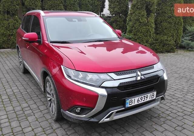 Червоний Міцубісі Аутлендер, об'ємом двигуна 3 л та пробігом 127 тис. км за 28500 $, фото 1 на Automoto.ua