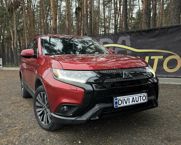 Красный Мицубиси Аутлендер, объемом двигателя 2.4 л и пробегом 197 тыс. км за 18700 $, фото 1 на Automoto.ua