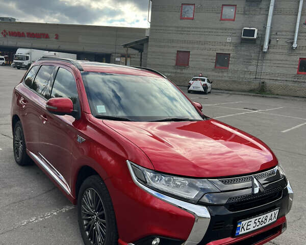Красный Мицубиси Аутлендер, объемом двигателя 2.36 л и пробегом 94 тыс. км за 26000 $, фото 1 на Automoto.ua
