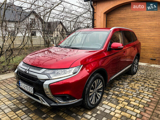 Красный Мицубиси Аутлендер, объемом двигателя 2 л и пробегом 40 тыс. км за 23500 $, фото 1 на Automoto.ua