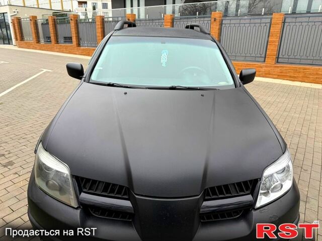 Мицубиси Аутлендер, объемом двигателя 2.4 л и пробегом 407 тыс. км за 5700 $, фото 1 на Automoto.ua