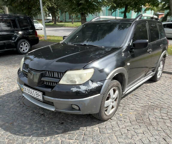 Мицубиси Аутлендер, объемом двигателя 2.4 л и пробегом 250 тыс. км за 4600 $, фото 1 на Automoto.ua