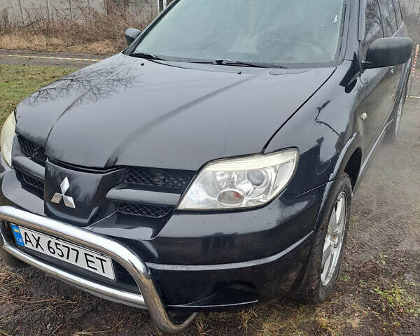 Мицубиси Аутлендер, объемом двигателя 2.4 л и пробегом 210 тыс. км за 6200 $, фото 1 на Automoto.ua