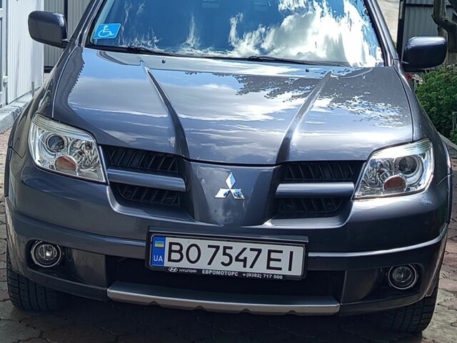 Серый Мицубиси Аутлендер, объемом двигателя 2 л и пробегом 106 тыс. км за 8369 $, фото 1 на Automoto.ua