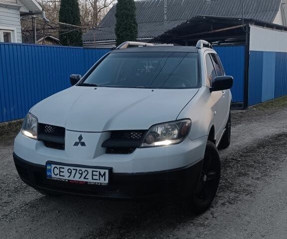 Сірий Міцубісі Аутлендер, об'ємом двигуна 2.4 л та пробігом 367 тис. км за 4900 $, фото 1 на Automoto.ua