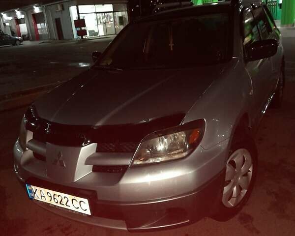 Серый Мицубиси Аутлендер, объемом двигателя 2 л и пробегом 307 тыс. км за 6800 $, фото 1 на Automoto.ua