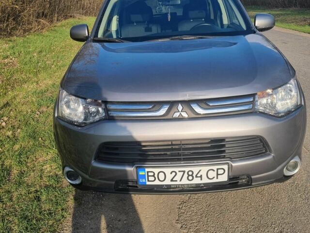Сірий Міцубісі Аутлендер, об'ємом двигуна 2.4 л та пробігом 150 тис. км за 12900 $, фото 1 на Automoto.ua