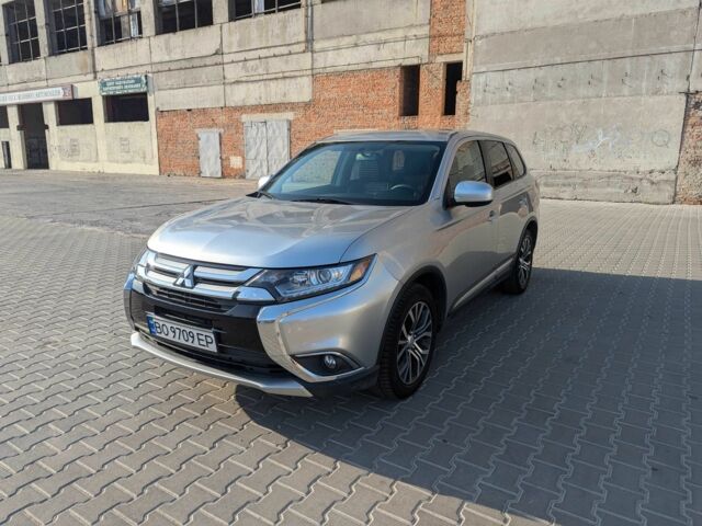 Серый Мицубиси Аутлендер, объемом двигателя 2.4 л и пробегом 142 тыс. км за 15999 $, фото 1 на Automoto.ua