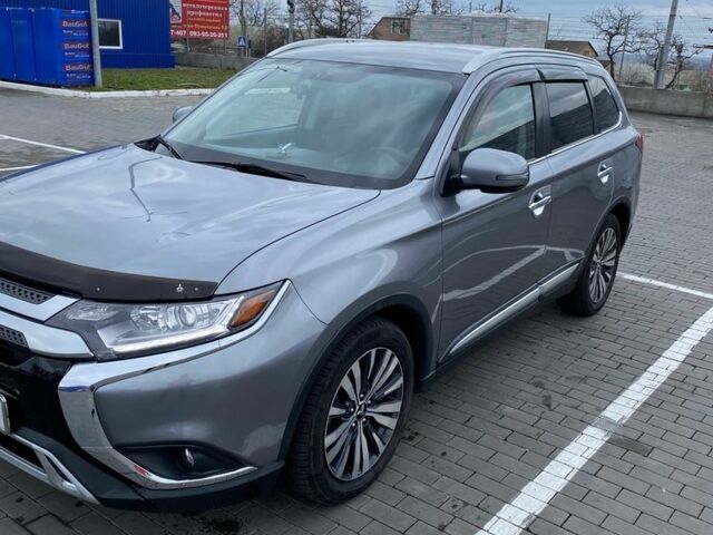 Серый Мицубиси Аутлендер, объемом двигателя 2.4 л и пробегом 160 тыс. км за 17500 $, фото 1 на Automoto.ua