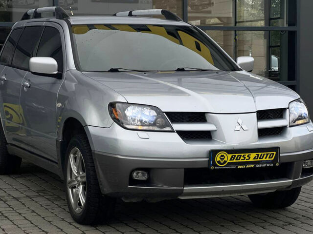 Сірий Міцубісі Аутлендер, об'ємом двигуна 2.4 л та пробігом 240 тис. км за 6700 $, фото 1 на Automoto.ua