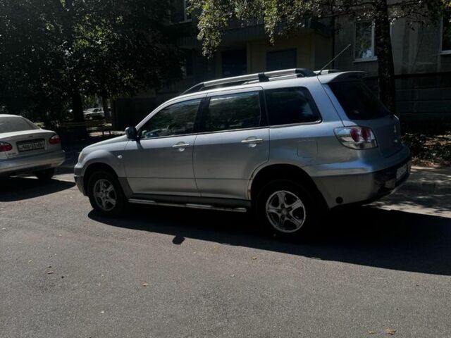 Сірий Міцубісі Аутлендер, об'ємом двигуна 2.4 л та пробігом 285 тис. км за 4400 $, фото 1 на Automoto.ua