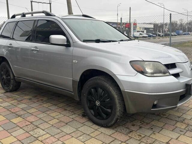 Сірий Міцубісі Аутлендер, об'ємом двигуна 2.4 л та пробігом 256 тис. км за 6700 $, фото 1 на Automoto.ua
