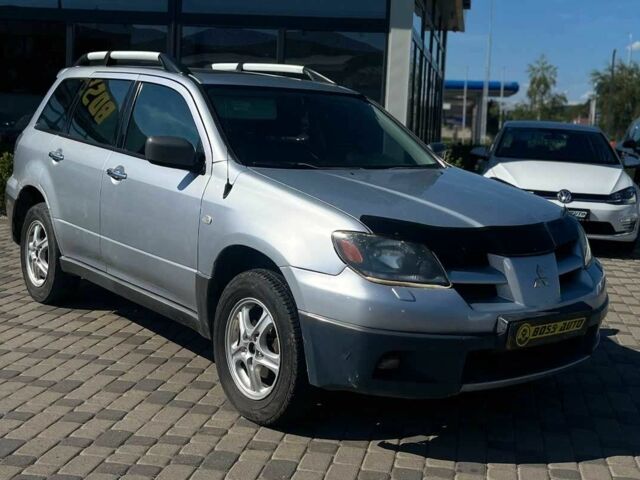 Серый Мицубиси Аутлендер, объемом двигателя 2.4 л и пробегом 240 тыс. км за 5700 $, фото 1 на Automoto.ua