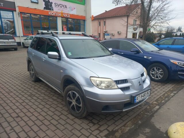 Серый Мицубиси Аутлендер, объемом двигателя 2.4 л и пробегом 246 тыс. км за 5500 $, фото 1 на Automoto.ua
