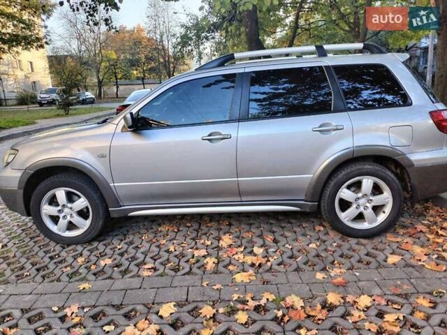 Серый Мицубиси Аутлендер, объемом двигателя 2.4 л и пробегом 186 тыс. км за 6350 $, фото 1 на Automoto.ua