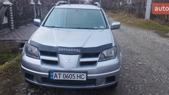Серый Мицубиси Аутлендер, объемом двигателя 2.4 л и пробегом 261 тыс. км за 5700 $, фото 1 на Automoto.ua