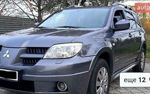 Сірий Міцубісі Аутлендер, об'ємом двигуна 2.38 л та пробігом 204 тис. км за 6500 $, фото 1 на Automoto.ua