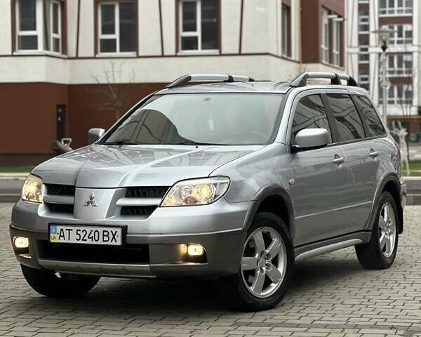 Сірий Міцубісі Аутлендер, об'ємом двигуна 2.4 л та пробігом 98 тис. км за 7199 $, фото 1 на Automoto.ua