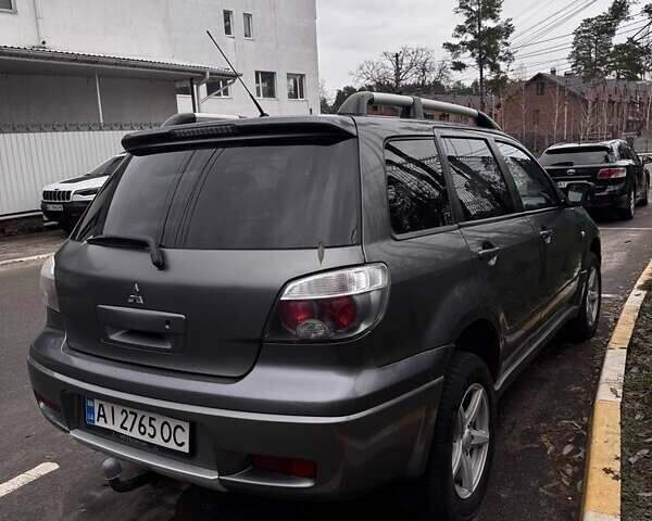 Сірий Міцубісі Аутлендер, об'ємом двигуна 2 л та пробігом 310 тис. км за 5200 $, фото 1 на Automoto.ua