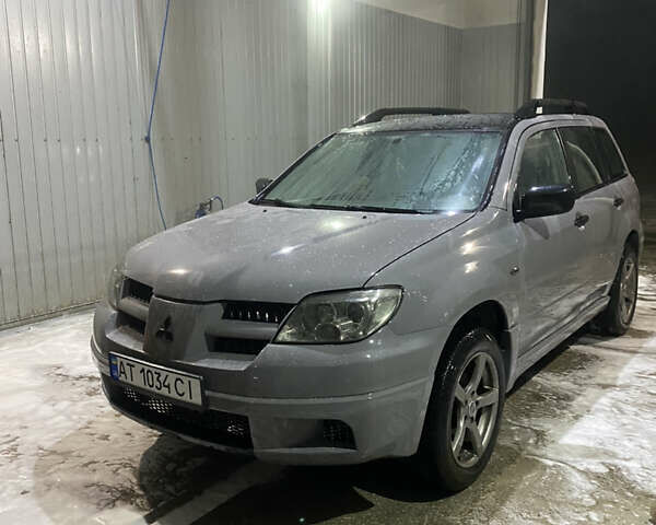 Сірий Міцубісі Аутлендер, об'ємом двигуна 2 л та пробігом 480 тис. км за 5600 $, фото 1 на Automoto.ua