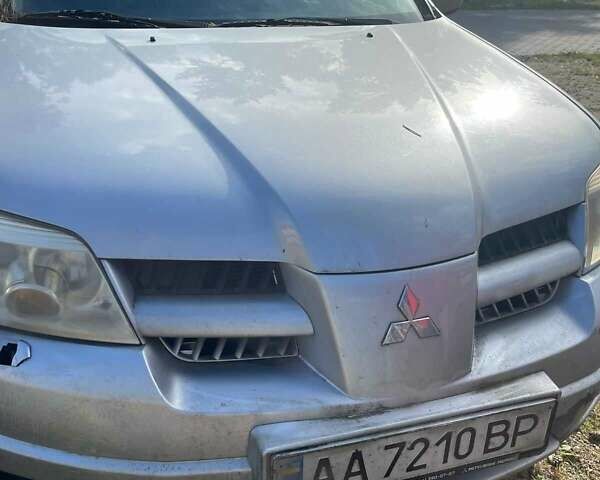 Серый Мицубиси Аутлендер, объемом двигателя 2.4 л и пробегом 127 тыс. км за 4400 $, фото 1 на Automoto.ua