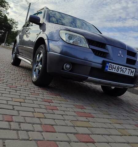 Серый Мицубиси Аутлендер, объемом двигателя 2.38 л и пробегом 189 тыс. км за 7600 $, фото 1 на Automoto.ua