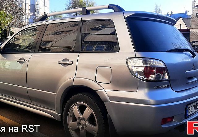 Сірий Міцубісі Аутлендер, об'ємом двигуна 2.4 л та пробігом 235 тис. км за 6000 $, фото 1 на Automoto.ua