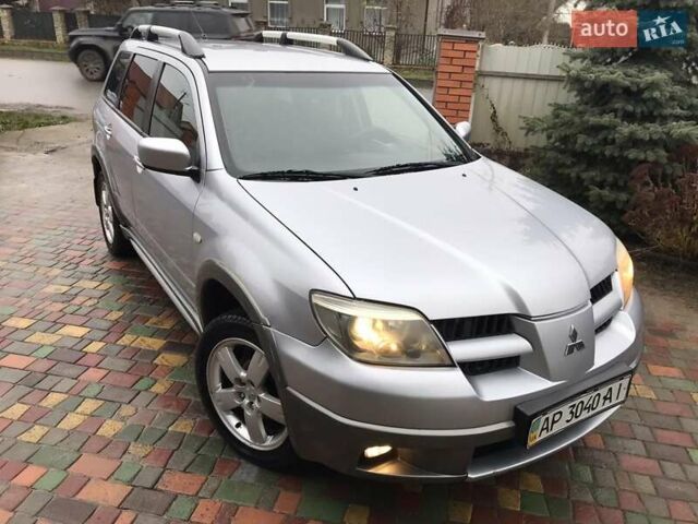 Сірий Міцубісі Аутлендер, об'ємом двигуна 2.4 л та пробігом 167 тис. км за 6400 $, фото 1 на Automoto.ua