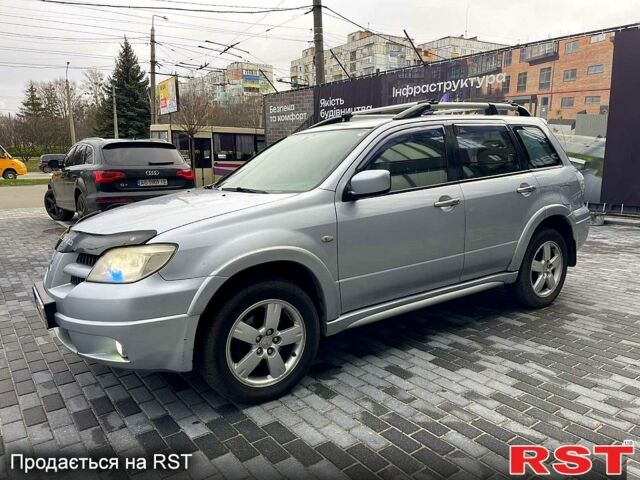 Серый Мицубиси Аутлендер, объемом двигателя 2.4 л и пробегом 280 тыс. км за 5800 $, фото 1 на Automoto.ua