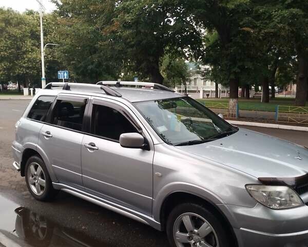Сірий Міцубісі Аутлендер, об'ємом двигуна 2.4 л та пробігом 182 тис. км за 8000 $, фото 1 на Automoto.ua