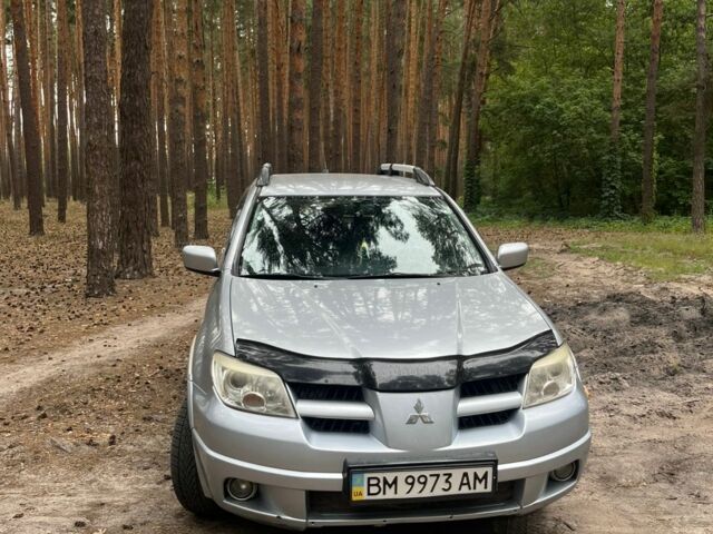 Серый Мицубиси Аутлендер, объемом двигателя 2.4 л и пробегом 225 тыс. км за 6500 $, фото 1 на Automoto.ua