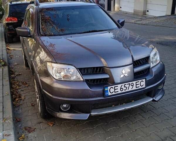 Серый Мицубиси Аутлендер, объемом двигателя 2 л и пробегом 172 тыс. км за 5900 $, фото 1 на Automoto.ua