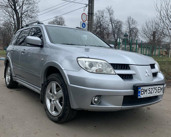 Серый Мицубиси Аутлендер, объемом двигателя 2 л и пробегом 247 тыс. км за 5999 $, фото 1 на Automoto.ua