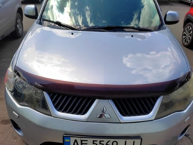 Серый Мицубиси Аутлендер, объемом двигателя 2.4 л и пробегом 216 тыс. км за 10500 $, фото 1 на Automoto.ua