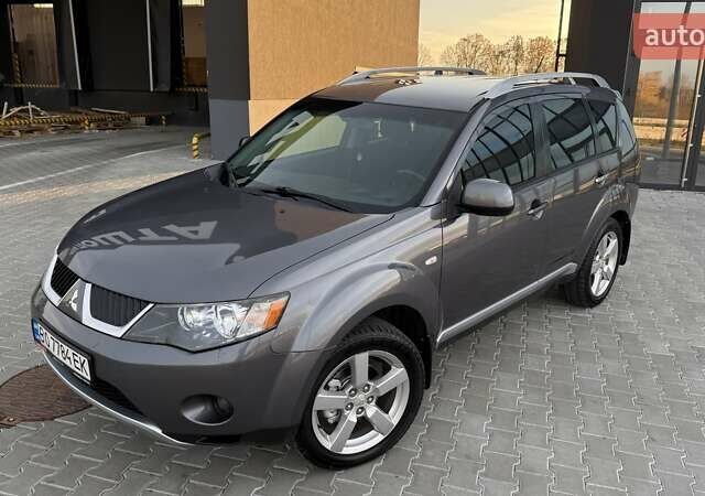 Серый Мицубиси Аутлендер, объемом двигателя 2.4 л и пробегом 174 тыс. км за 9599 $, фото 1 на Automoto.ua