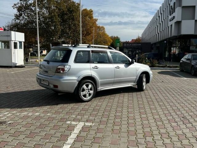 Серый Мицубиси Аутлендер, объемом двигателя 2 л и пробегом 214 тыс. км за 7300 $, фото 1 на Automoto.ua