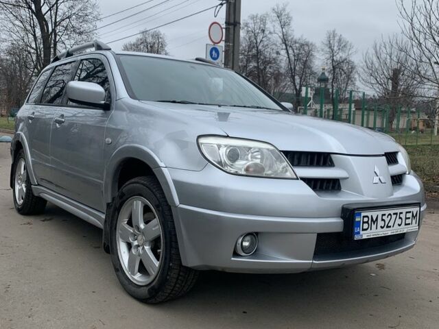 Серый Мицубиси Аутлендер, объемом двигателя 2 л и пробегом 247 тыс. км за 5999 $, фото 1 на Automoto.ua