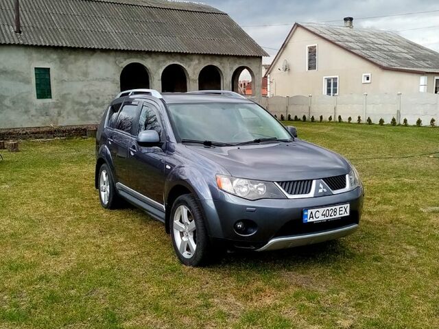 Серый Мицубиси Аутлендер, объемом двигателя 2.4 л и пробегом 307 тыс. км за 9200 $, фото 1 на Automoto.ua