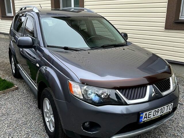 Серый Мицубиси Аутлендер, объемом двигателя 2.4 л и пробегом 153 тыс. км за 11500 $, фото 1 на Automoto.ua