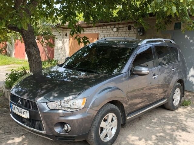 Серый Мицубиси Аутлендер, объемом двигателя 2.4 л и пробегом 151 тыс. км за 11100 $, фото 1 на Automoto.ua