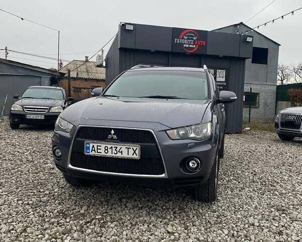 Серый Мицубиси Аутлендер, объемом двигателя 2.36 л и пробегом 143 тыс. км за 11500 $, фото 1 на Automoto.ua