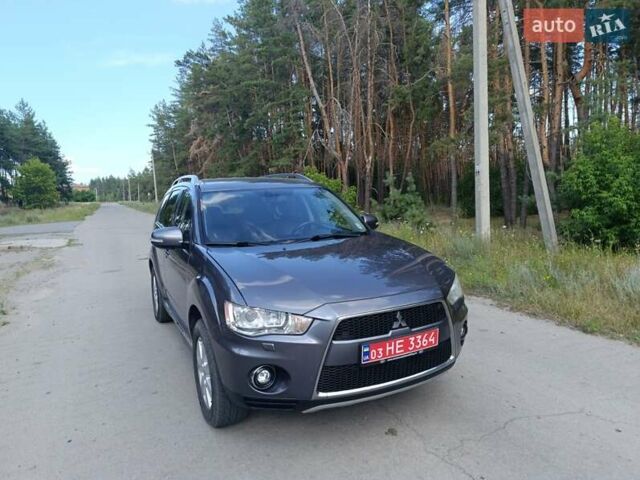 Серый Мицубиси Аутлендер, объемом двигателя 2.4 л и пробегом 220 тыс. км за 11800 $, фото 1 на Automoto.ua
